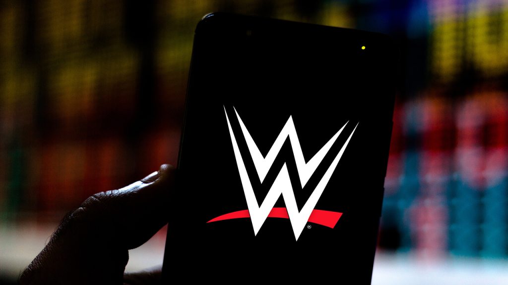 In this photo illustration the World Wrestling Entertainment (WWE) logo is seen displayed on a smartphone.